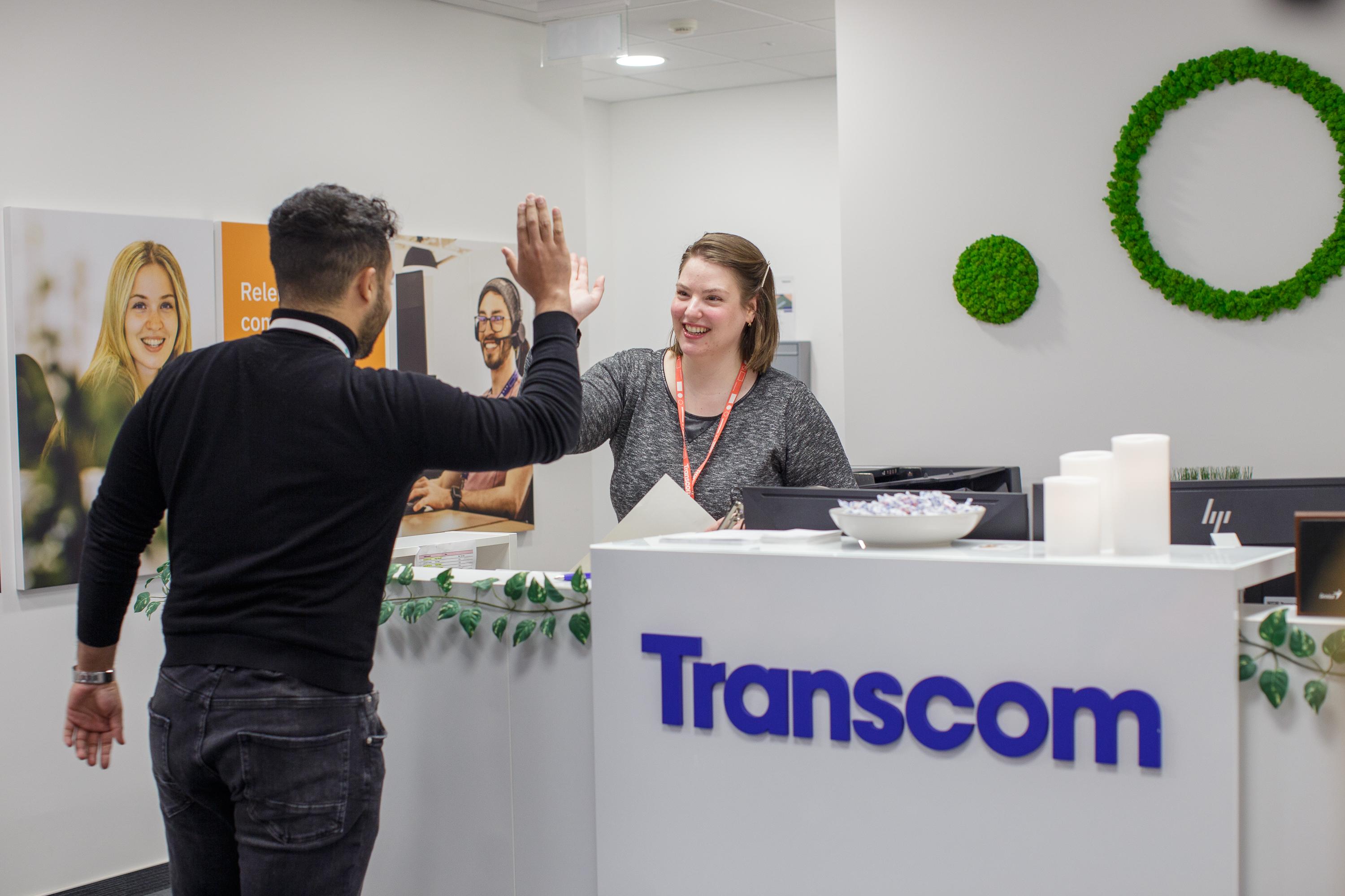 Transcom collegues giving hi fi