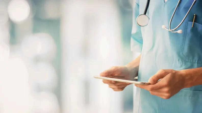 Doctor holding tablet