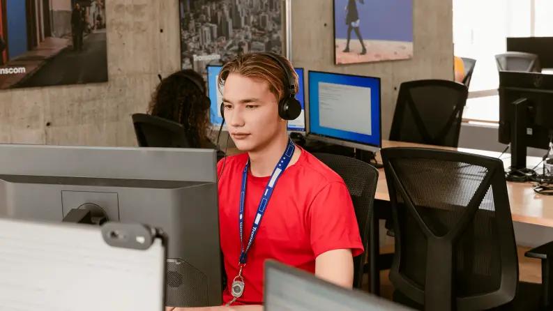 Boy waearing headset and red t-shirt
