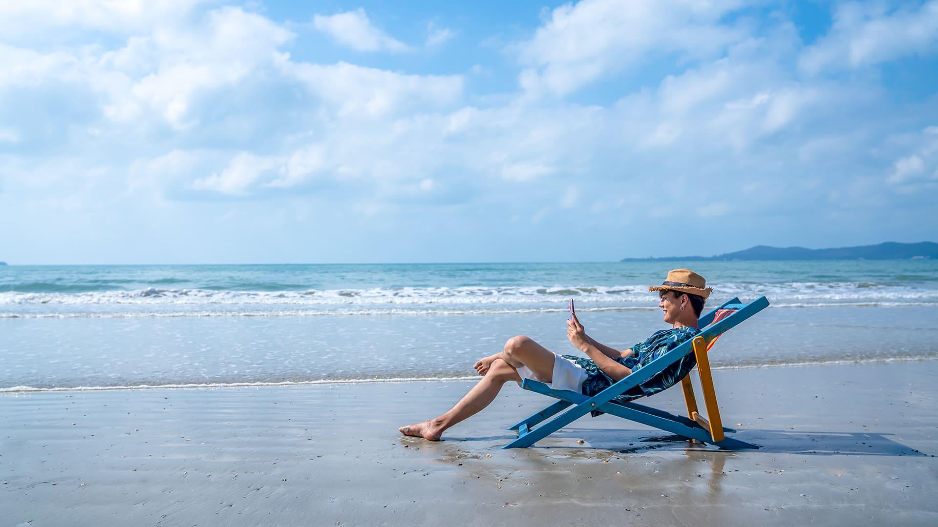 Men sitting behind beach view