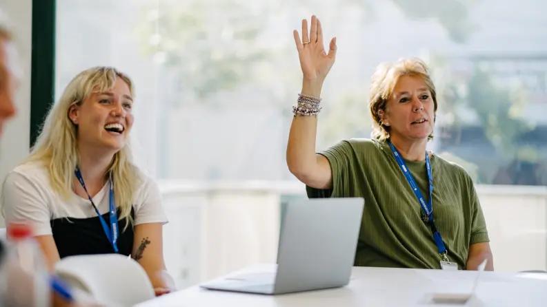 Women raising hand
