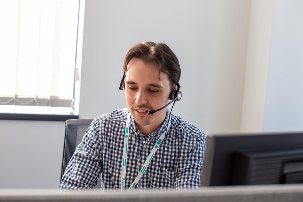 Man with headset providing customer support